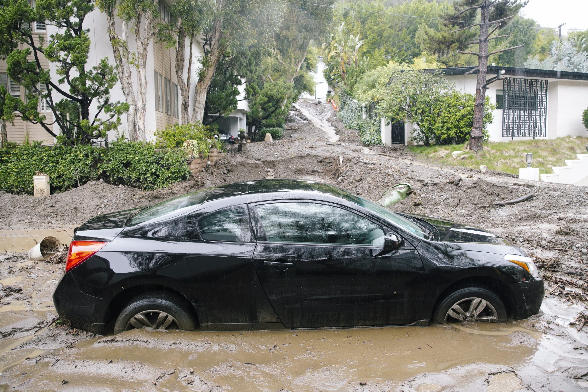 In pictures: extraordinary rainfall causes flooding and landslides in California